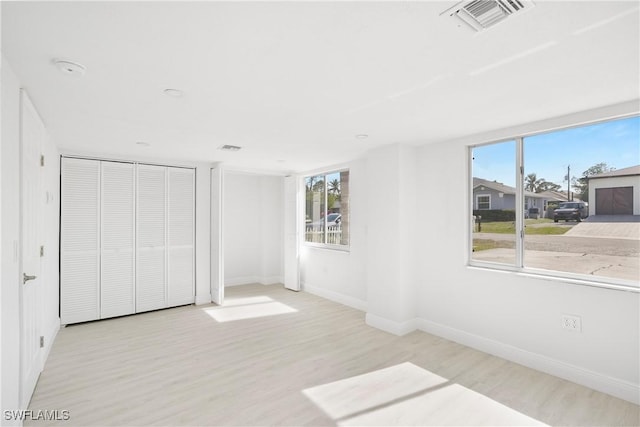 unfurnished bedroom with light hardwood / wood-style floors