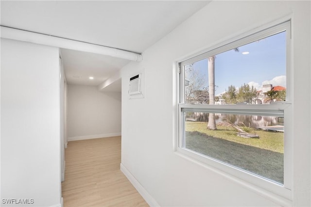 corridor featuring light hardwood / wood-style floors