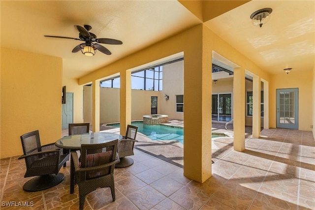 view of swimming pool featuring a patio, ceiling fan, and an in ground hot tub