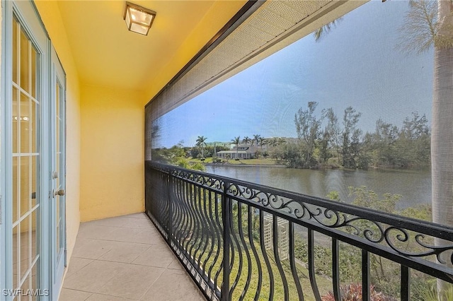 balcony featuring a water view