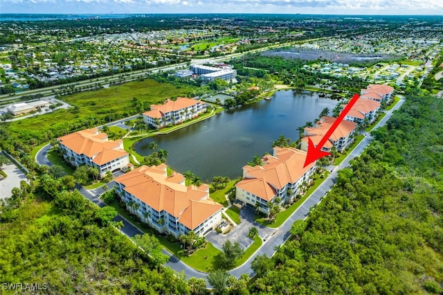 birds eye view of property featuring a water view