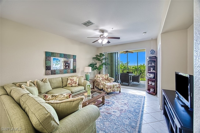 living room with ceiling fan and light tile patterned flooring