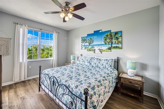 bedroom with hardwood / wood-style floors and ceiling fan