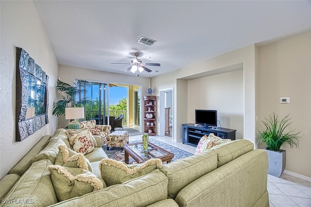 tiled living room with ceiling fan