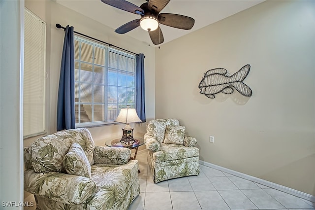 sitting room with light tile patterned flooring and ceiling fan