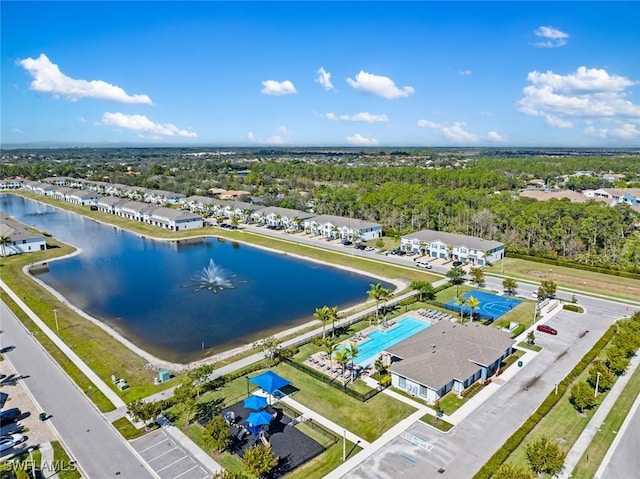 birds eye view of property with a water view