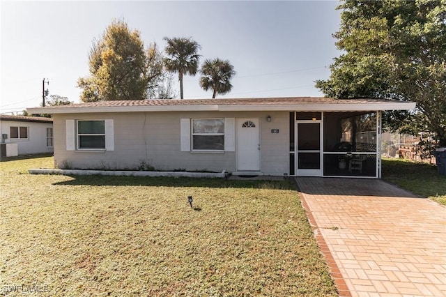 ranch-style house with a front lawn