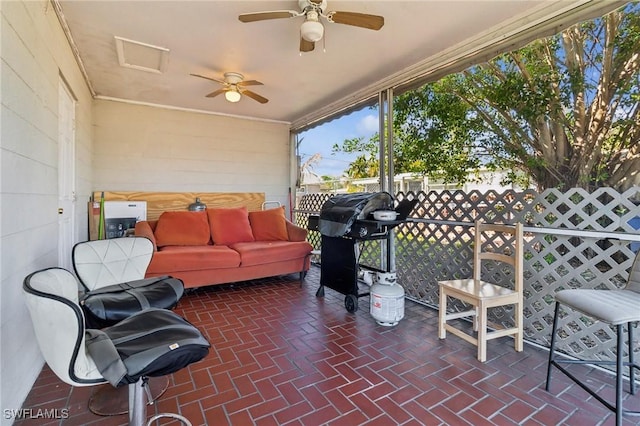 sunroom / solarium with ceiling fan