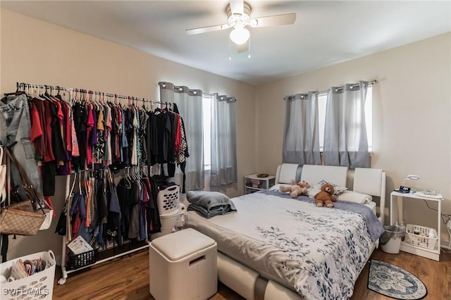 bedroom featuring ceiling fan and dark hardwood / wood-style flooring