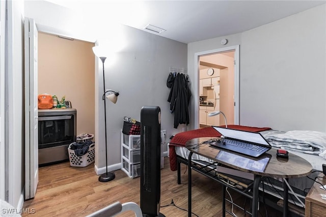 dining space with hardwood / wood-style flooring