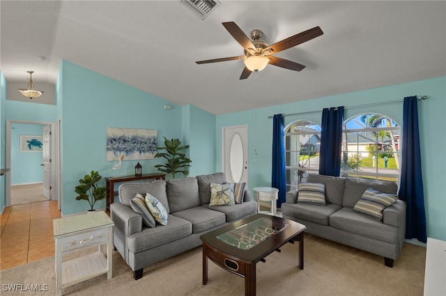 tiled living room with lofted ceiling and ceiling fan