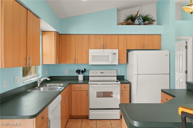 kitchen featuring white appliances, lofted ceiling, sink, and light tile patterned floors