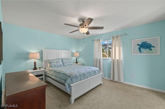 bedroom with light colored carpet and ceiling fan