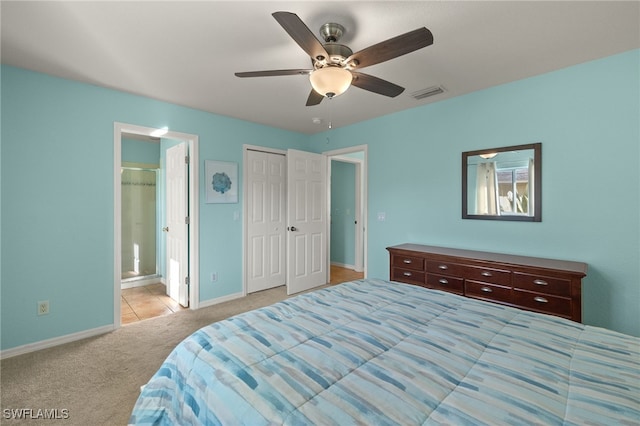 carpeted bedroom with connected bathroom, a closet, and ceiling fan