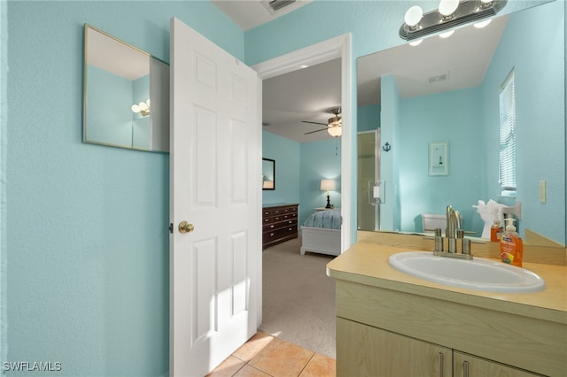 bathroom with tile patterned flooring and vanity