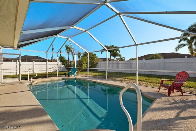 view of pool with a patio and a lanai