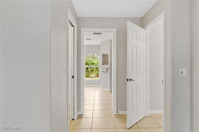 hallway featuring light tile patterned floors