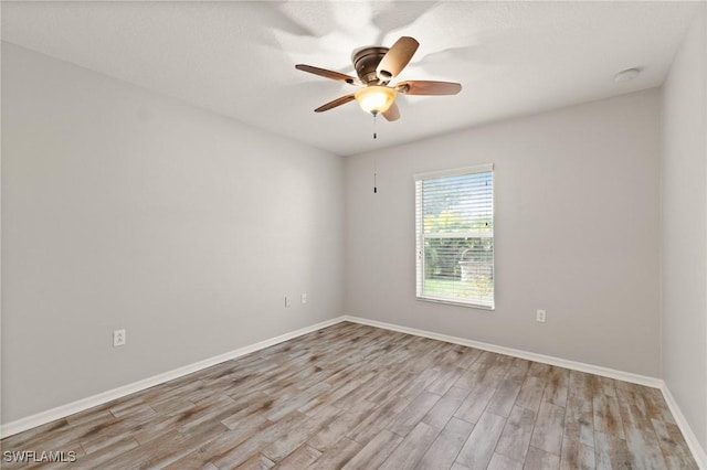 empty room featuring light hardwood / wood-style floors and ceiling fan