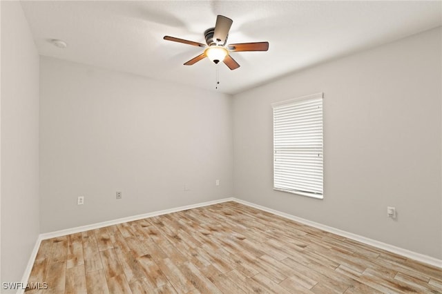 spare room with ceiling fan and light hardwood / wood-style floors