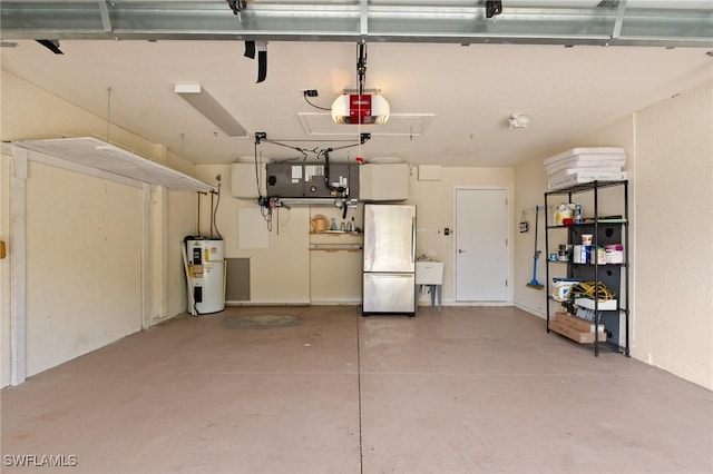 garage with a garage door opener, electric water heater, and stainless steel refrigerator