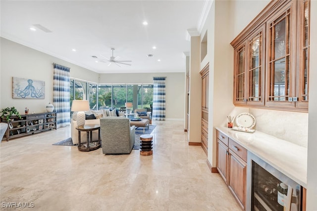 living room featuring wine cooler, crown molding, and ceiling fan