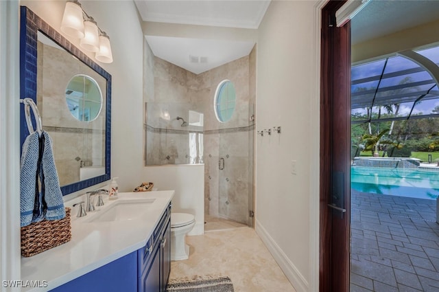 bathroom featuring a shower with door, vanity, and toilet