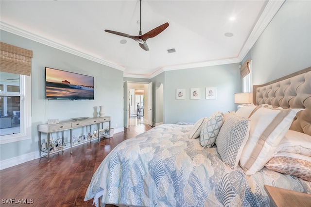 bedroom featuring multiple windows, ornamental molding, dark hardwood / wood-style floors, and ceiling fan