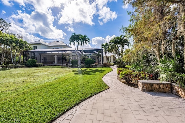 view of yard with a lanai