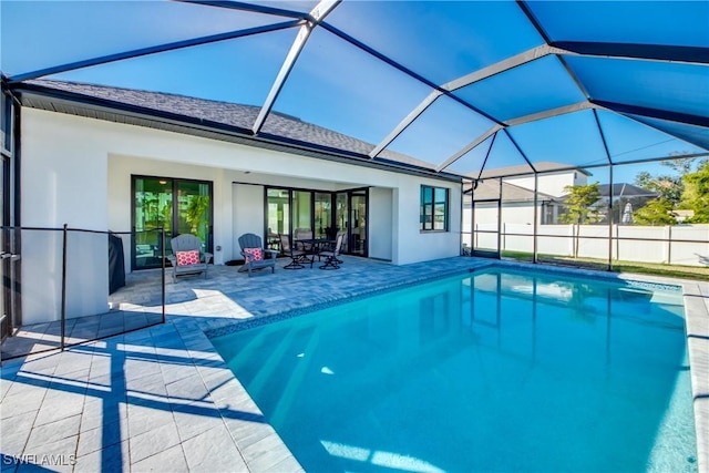 view of pool featuring a lanai and a patio area