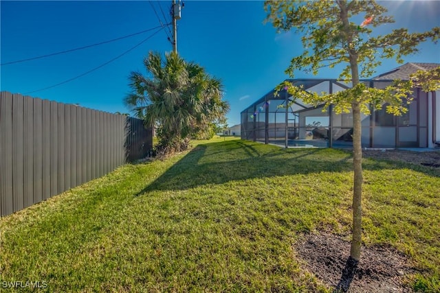 view of yard featuring a lanai