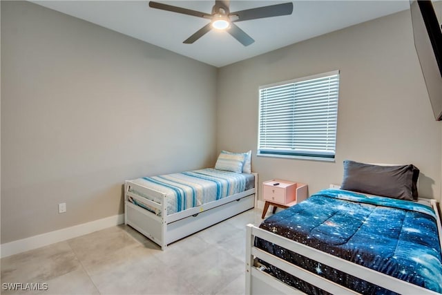 tiled bedroom with ceiling fan