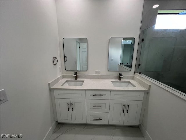 bathroom with vanity and a shower