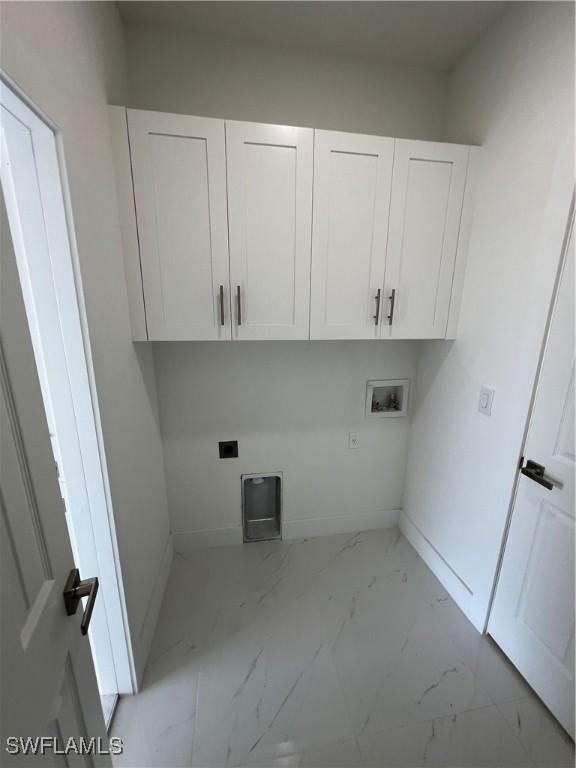 washroom featuring washer hookup, cabinets, and hookup for an electric dryer