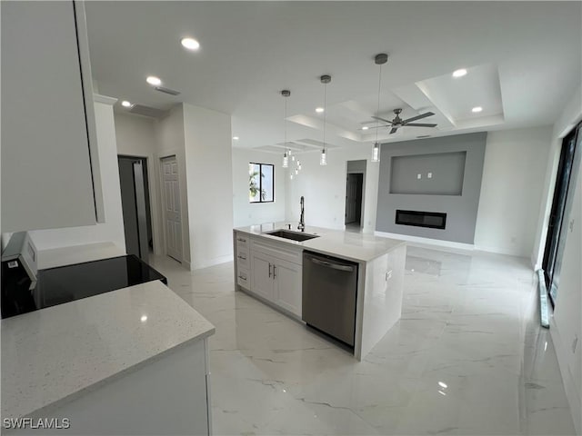 kitchen with sink, white cabinetry, stainless steel dishwasher, pendant lighting, and a kitchen island with sink