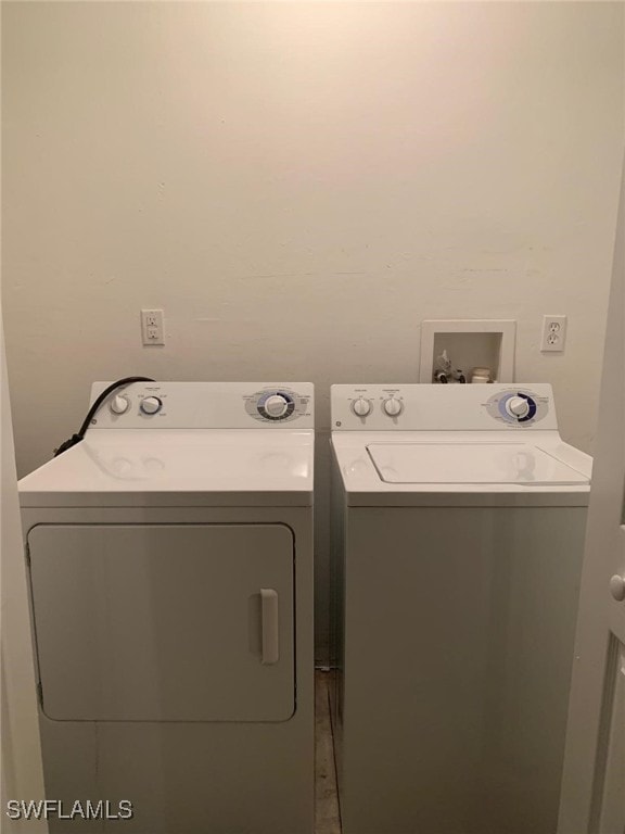 washroom featuring independent washer and dryer