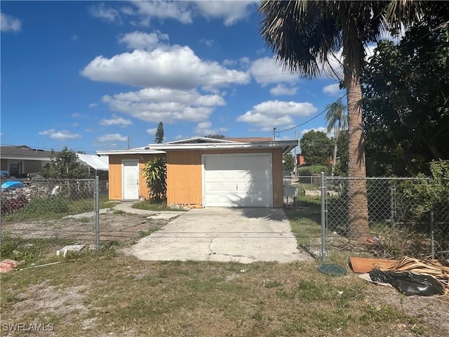 exterior space with a garage and an outdoor structure