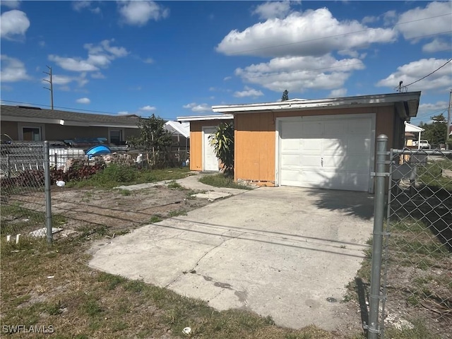 view of front of house featuring a garage and an outdoor structure