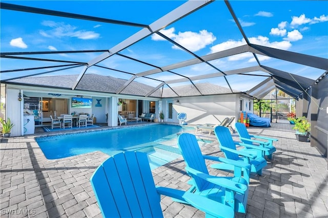 view of swimming pool with ceiling fan, a patio, an outdoor living space, and glass enclosure