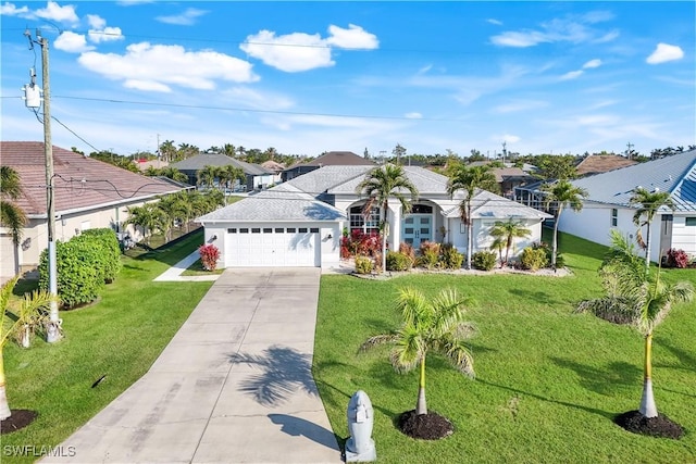 view of front of home featuring a garage and a front lawn