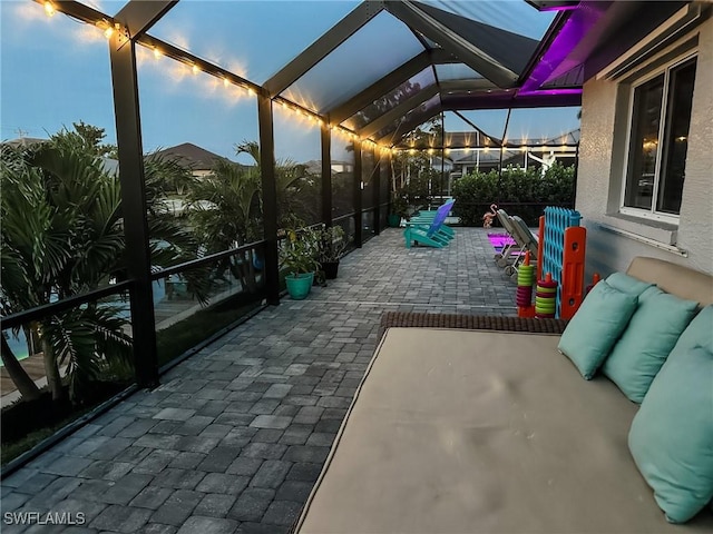 patio terrace at dusk with glass enclosure