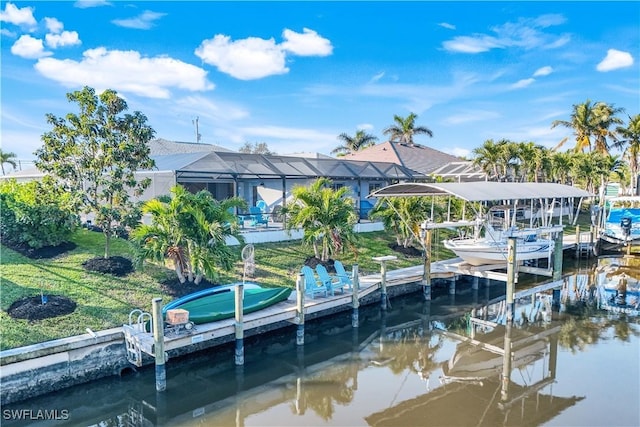 dock area featuring a water view, glass enclosure, and a lawn