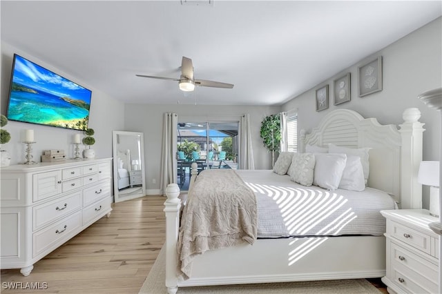 bedroom featuring ceiling fan, light hardwood / wood-style flooring, and access to outside