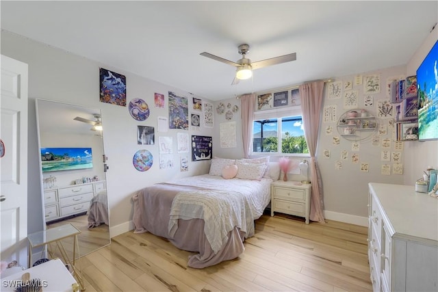 bedroom with ceiling fan and light hardwood / wood-style floors