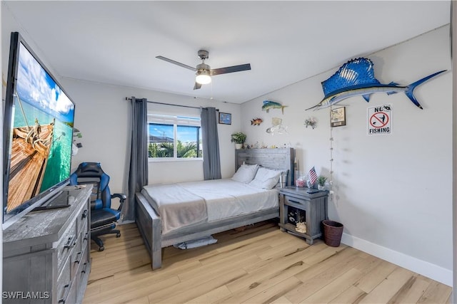 bedroom with ceiling fan and light wood-type flooring