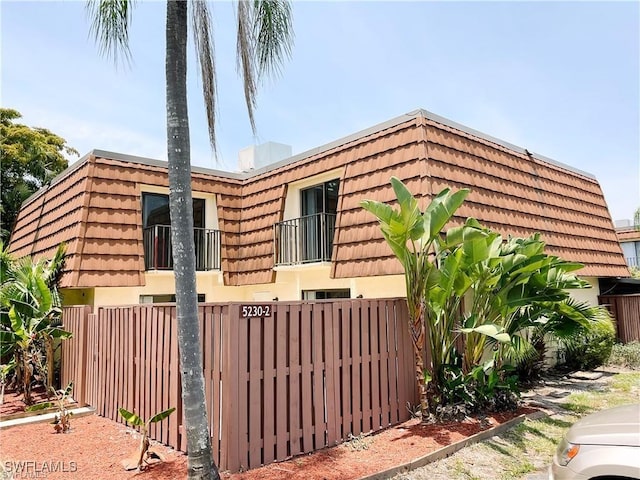 view of property exterior with a balcony