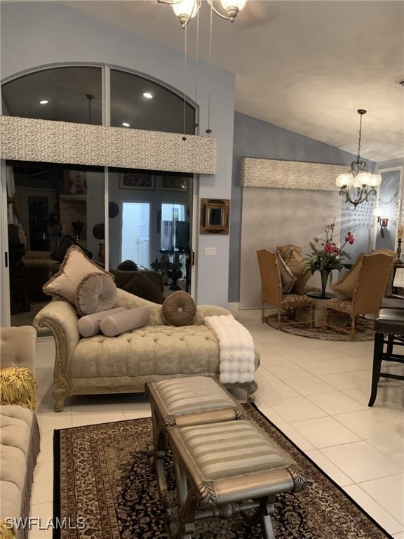 tiled living room with lofted ceiling and a chandelier