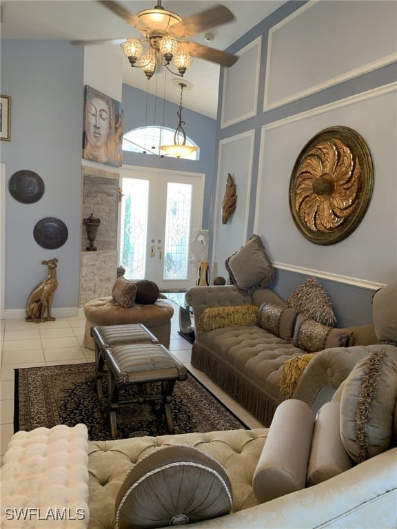 living room featuring french doors, tile patterned floors, and high vaulted ceiling