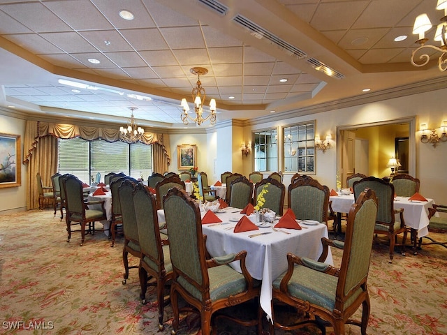 carpeted dining room featuring crown molding and a notable chandelier