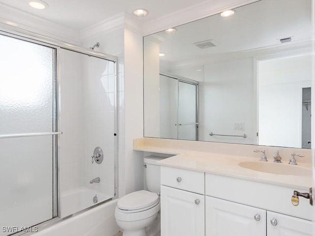 full bathroom featuring enclosed tub / shower combo, vanity, and toilet