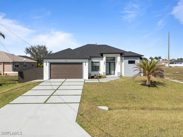 prairie-style house with a garage and a front yard